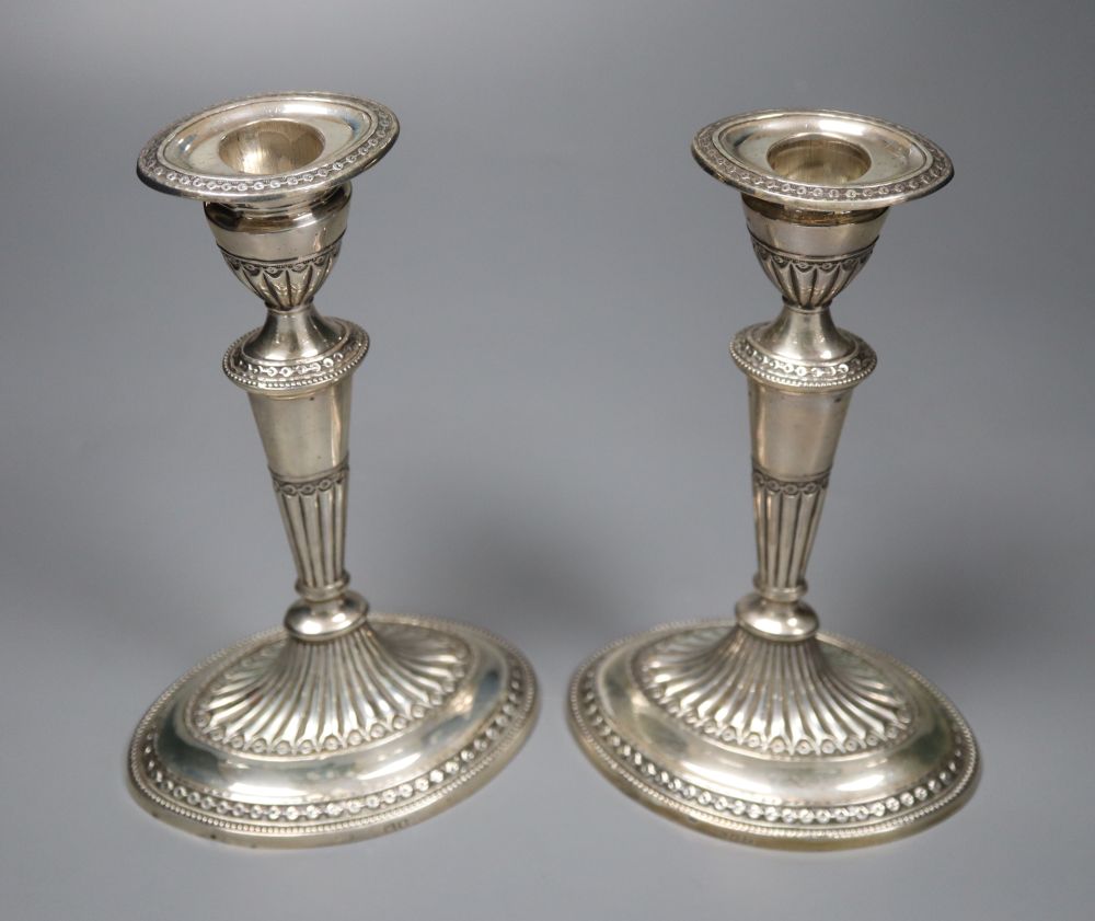 A pair of late Victorian silver oval candlesticks, Thomas Bradbury & Sons, London, 1896, weighted, 18.9cm.